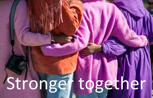 A group of four people with their arms across each other&#039;s backs with the words &#039;Stronger Together&#039; written at the bottom of the image.